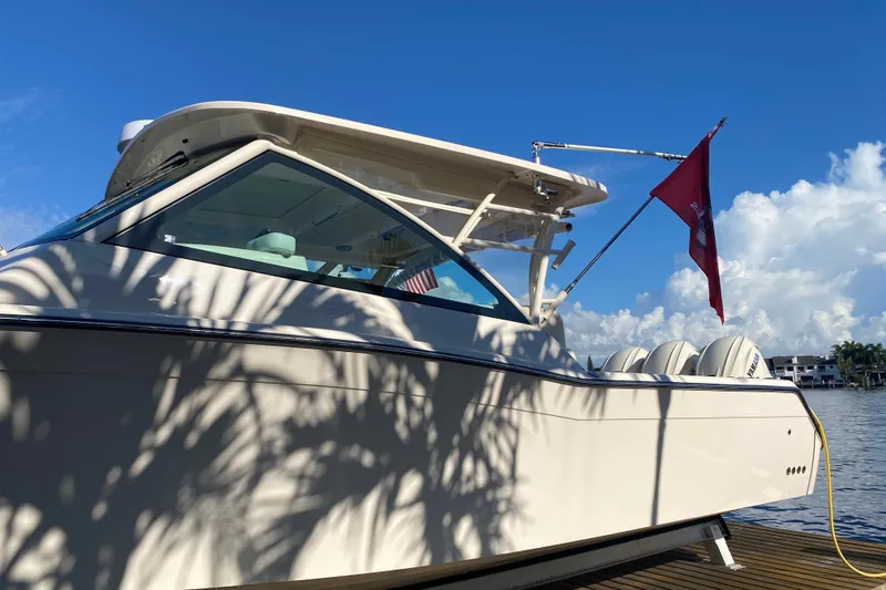  Yacht Photos Pics 2024 Grady-White Freedom 375 boat docked under clear blue sky.