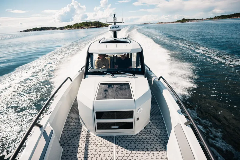  Yacht Photos Pics 2026 XO Boats DFNDR 9 cruising on open water, showcasing sleek design and performance.