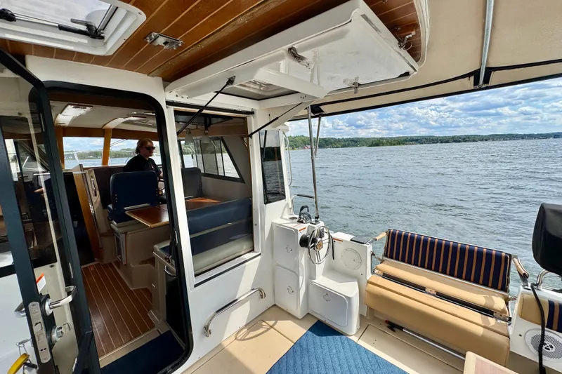  Yacht Photos Pics Interior view of 2014 Cutwater C30 Sedan NW boat with lake backdrop.