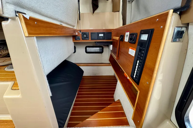  Yacht Photos Pics 2014 Cutwater C30 Sedan NW interior with wood paneling and control panel.
