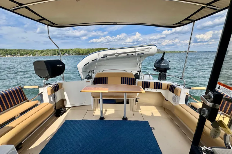  Yacht Photos Pics 2014 Cutwater C30 Sedan NW boat interior with seating, table, and scenic lake view.