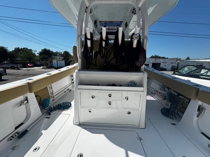  Yacht Photos Pics 2024 Sportsman Open 322 Center Console boat interior with storage and seating.
