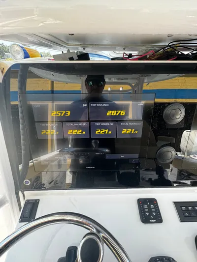  Yacht Photos Pics 2024 Sportsman Open 322 Center Console dashboard with trip data and Garmin display.