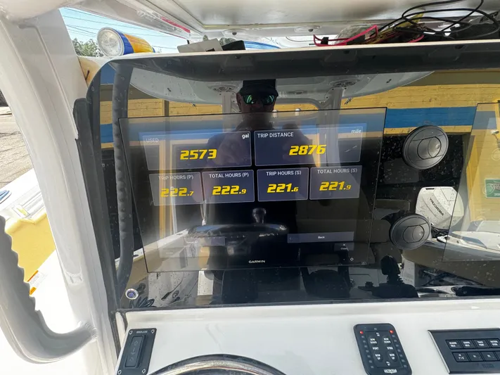  Yacht Photos Pics 2024 Sportsman Open 322 Center Console dashboard displaying trip data and fuel usage.