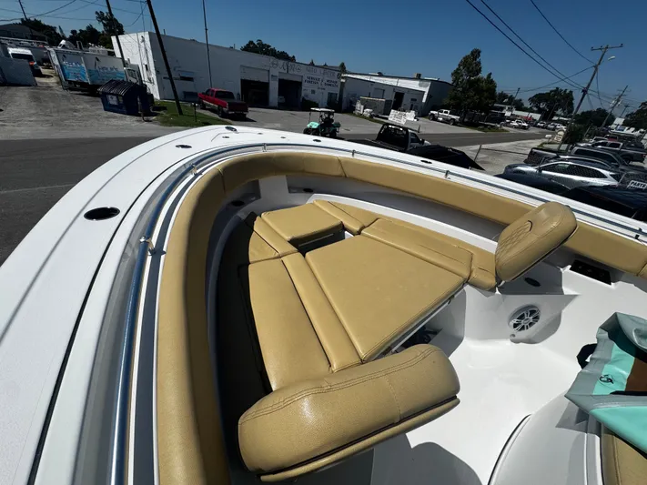  Yacht Photos Pics 2024 Sportsman Open 322 Center Console boat with tan seating in urban setting.
