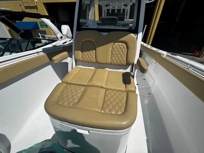  Yacht Photos Pics 2024 Sportsman Open 322 Center Console boat with tan cushioned seating.