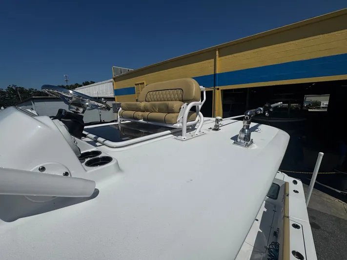  Yacht Photos Pics 2024 Sportsman Open 322 Center Console boat with helm and seating, docked outdoors.