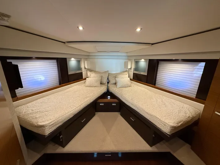 Swift Wing Yacht Photos Pics Luxurious 2016 Tiara Yachts 50 Coupe cabin with twin beds and modern decor.