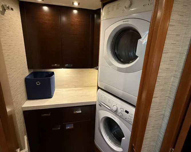 Swift Wing Yacht Photos Pics Laundry area in 2016 Tiara Yachts 50 Coupe with stacked washer and dryer.