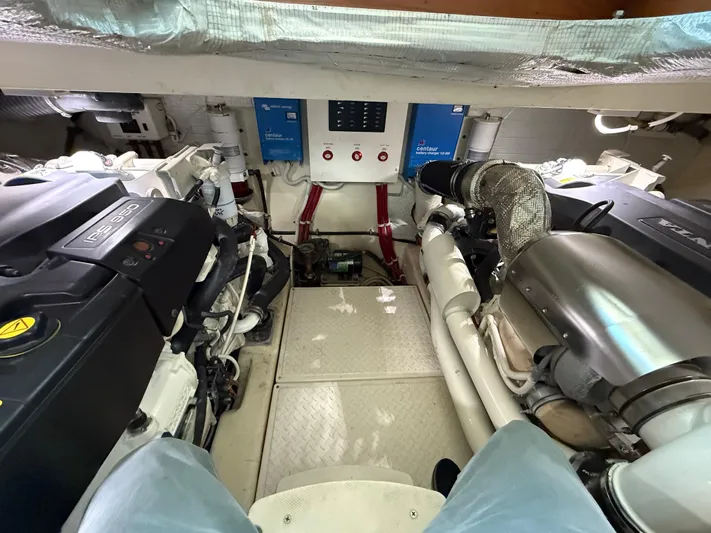 Swift Wing Yacht Photos Pics Engine room of 2016 Tiara Yachts 50 Coupe, showcasing dual engines and control systems.