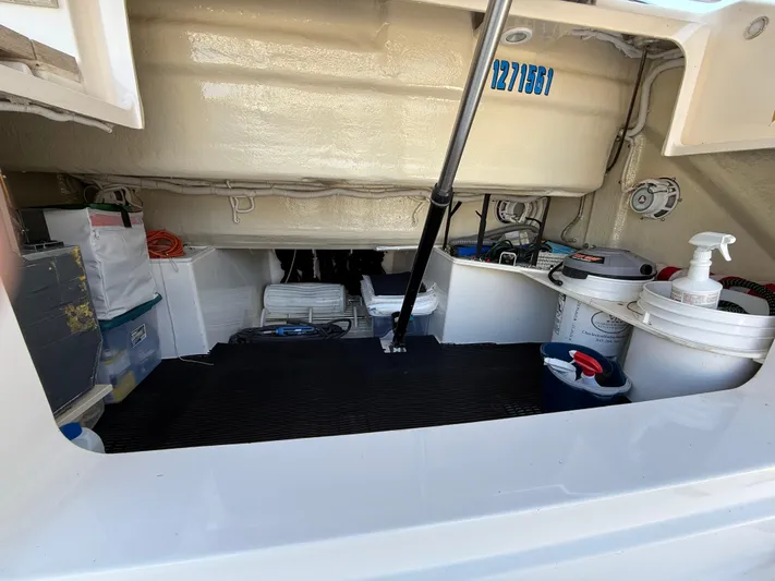 Swift Wing Yacht Photos Pics 2016 Tiara Yachts 50 Coupe storage compartment with equipment and supplies.