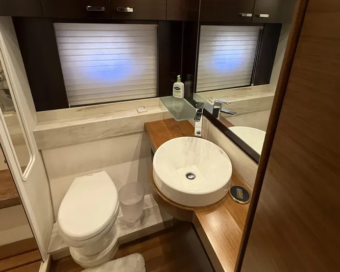 Swift Wing Yacht Photos Pics Luxurious bathroom in 2016 Tiara Yachts 50 Coupe with modern fixtures and elegant design.