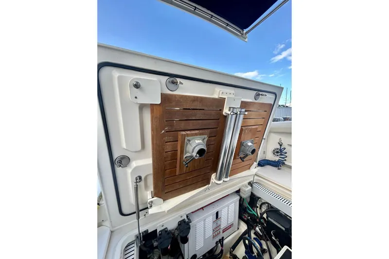  Yacht Photos Pics 2017 Boston Whaler 380 Outrage boat interior, featuring storage compartments and equipment.