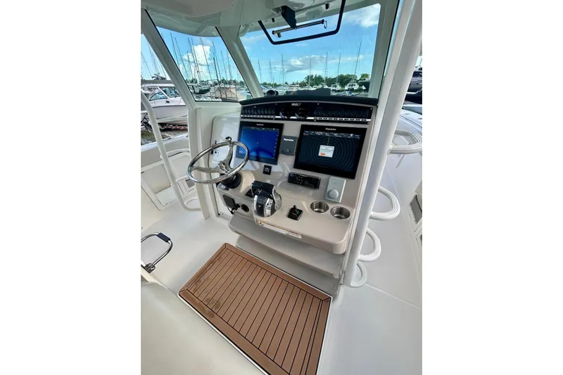  Yacht Photos Pics 2017 Boston Whaler 380 Outrage helm with advanced navigation and control systems.