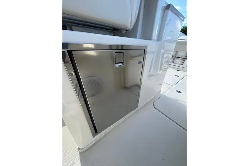  Yacht Photos Pics 2017 Boston Whaler 380 Outrage interior, featuring sleek stainless steel cabinetry.