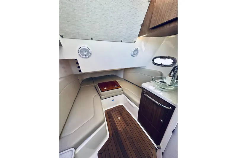  Yacht Photos Pics Luxurious interior cabin of 2017 Boston Whaler 380 Outrage with seating and sink.