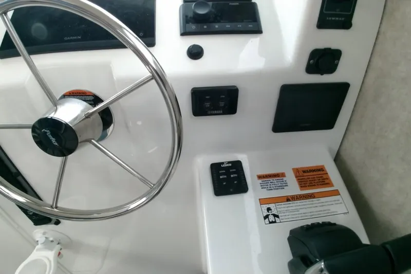  Yacht Photos Pics 2024 Parker 2820 XLD Sport Cabin helm with steering wheel and control panel.
