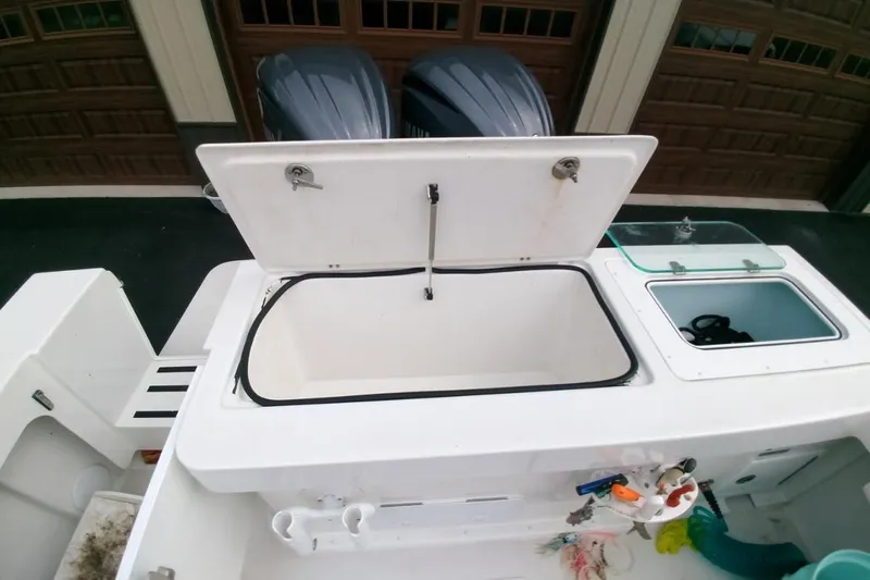  Yacht Photos Pics 2024 Parker 2820 XLD Sport Cabin boat with open storage compartments and dual engines.