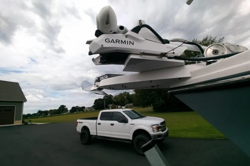  Yacht Photos Pics 2024 Parker 2820 XLD Sport Cabin with Garmin equipment, parked near a white truck.