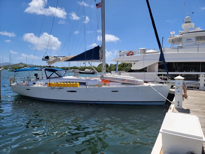  Yacht Photos Pics 2011 Beneteau Oceanis 50 sailboat docked under clear blue sky.