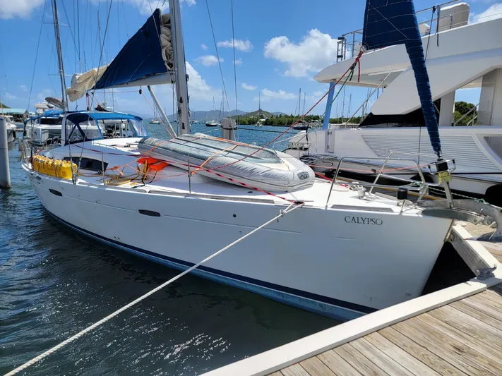  Yacht Photos Pics 2011 Beneteau Oceanis 50 sailboat docked at marina under clear blue sky.