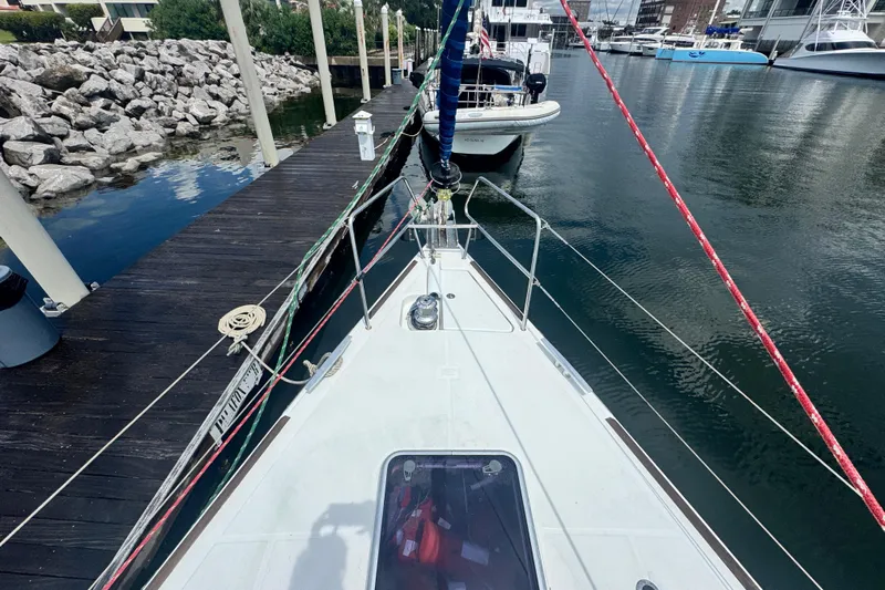  Yacht Photos Pics Beneteau Oceanis 50 sailboat docked at marina, 2011 model, view from bow.