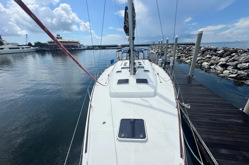  Yacht Photos Pics Beneteau Oceanis 50 sailboat docked at marina, 2011 model, calm waters, clear sky.