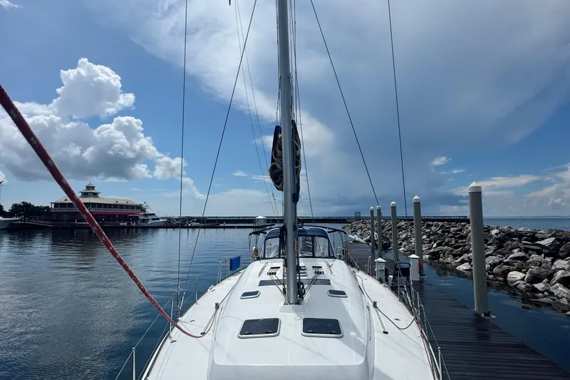  Yacht Photos Pics 2011 Beneteau Oceanis 50 sailboat docked at marina under blue sky.