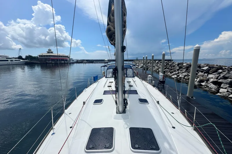  Yacht Photos Pics 2011 Beneteau Oceanis 50 sailboat docked at marina under blue sky.