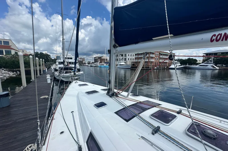  Yacht Photos Pics Beneteau Oceanis 50 sailboat docked at marina, 2011 model, with clear skies and waterfront view.