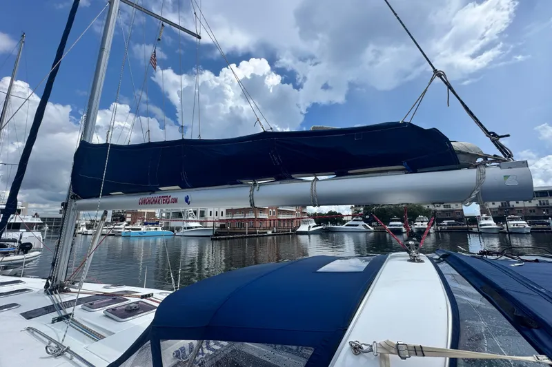 Yacht Photos Pics Sailboat Beneteau Oceanis 50, 2011 model, docked at marina under cloudy sky.