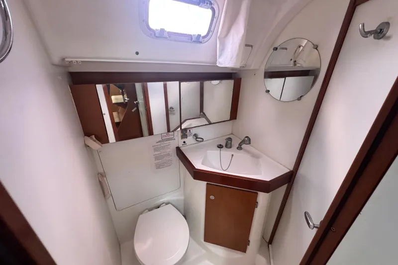  Yacht Photos Pics Bathroom interior of 2011 Beneteau Oceanis 50 yacht, featuring sink, mirror, and toilet.