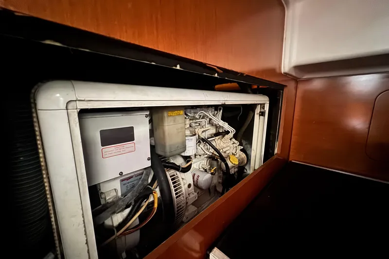  Yacht Photos Pics Engine compartment of a 2011 Beneteau Oceanis 50 sailboat, showcasing mechanical components.