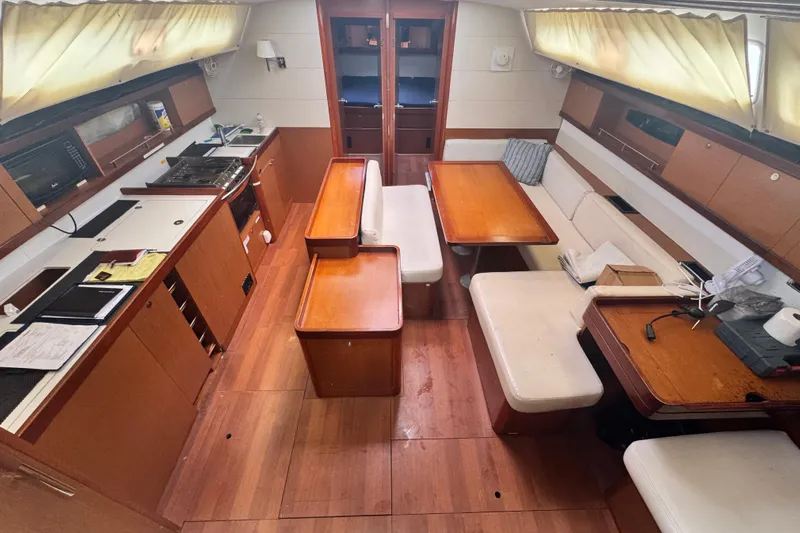  Yacht Photos Pics Interior of 2011 Beneteau Oceanis 50 yacht with wood finish and seating area.