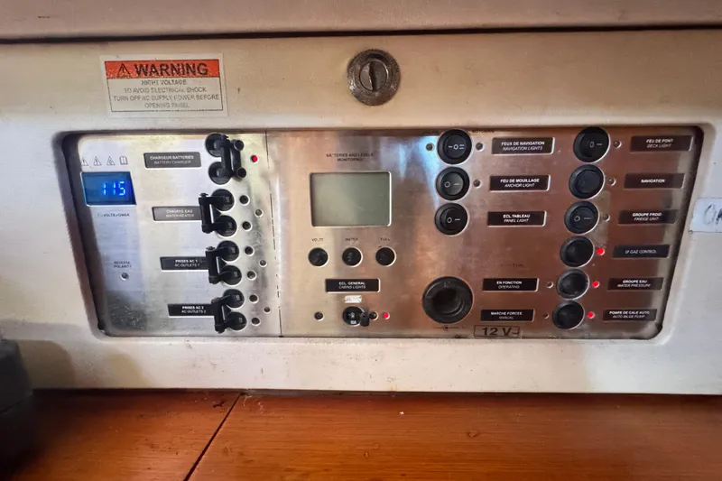  Yacht Photos Pics Control panel of a 2011 Beneteau Oceanis 50 yacht, featuring various switches and indicators.