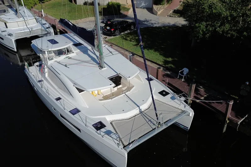 Adonis II Yacht Photos Pics 2017 Leopard 48 catamaran docked, aerial view showcasing sleek design and spacious deck.
