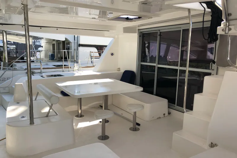 Adonis II Yacht Photos Pics Luxurious 2017 Leopard 48 yacht interior with modern seating and dining area.