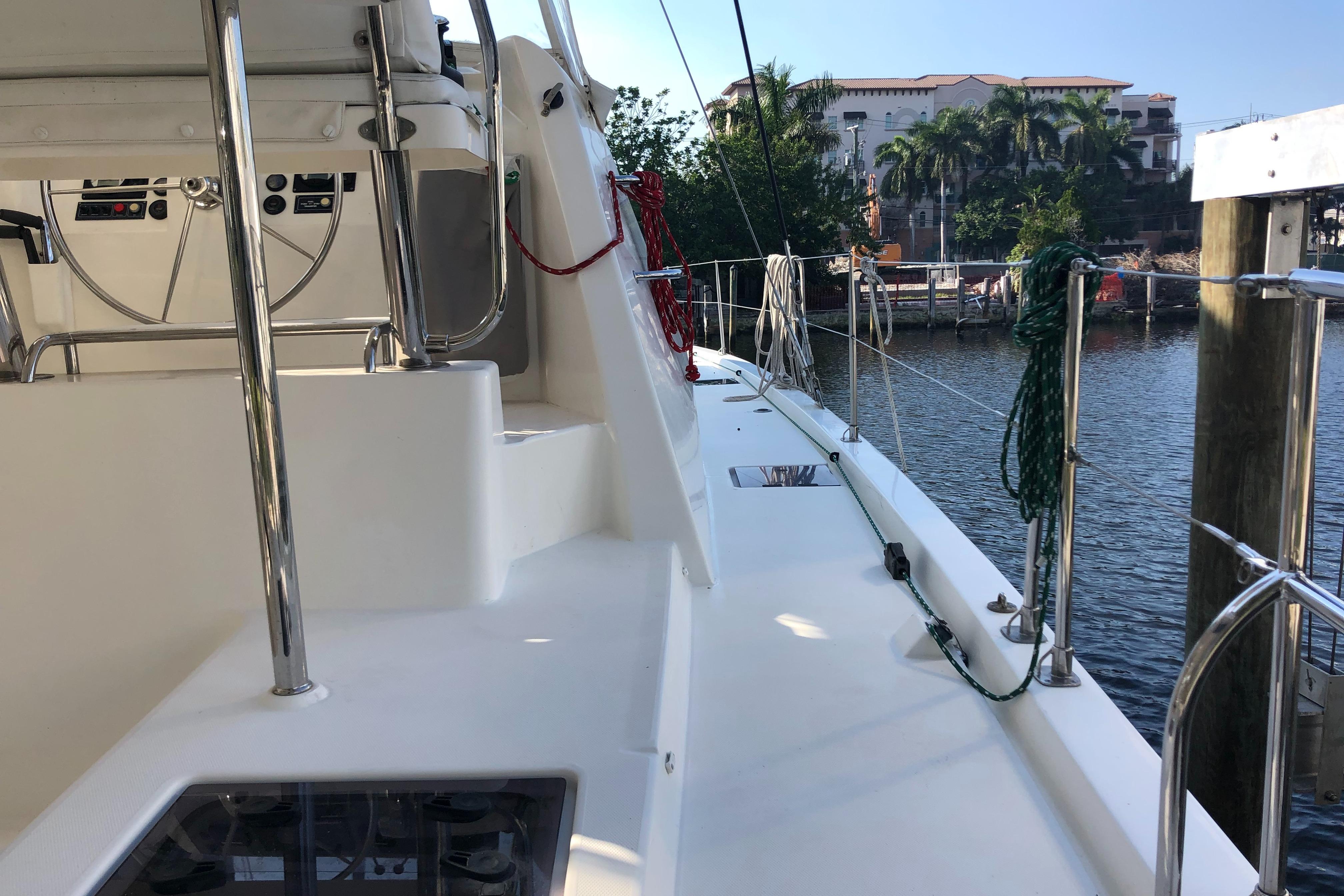 Deck view of 2017 Leopard 48 yacht docked by waterfront.