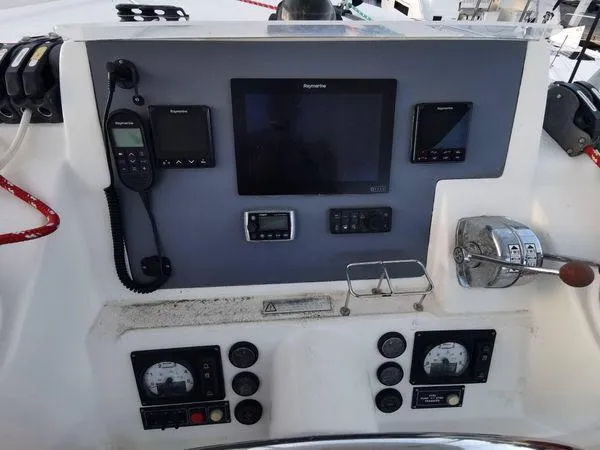 Adonis II Yacht Photos Pics Control panel of a 2017 Leopard 48 yacht with navigation and communication equipment.