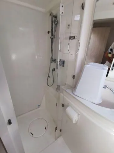 Adonis II Yacht Photos Pics Bathroom interior of a 2017 Leopard 48 yacht, featuring a shower and sink area.