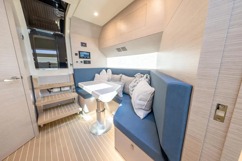 Dealership II Yacht Photos Pics Luxurious interior of 2023 Scout 530 LXF yacht with modern seating and table.