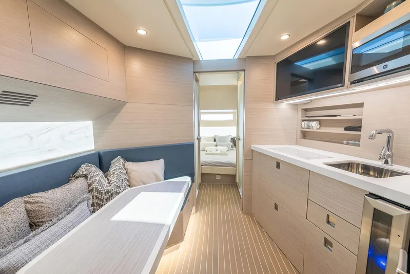 Dealership II Yacht Photos Pics Luxurious interior of 2023 Scout 530 LXF yacht with modern kitchen and cozy seating area.