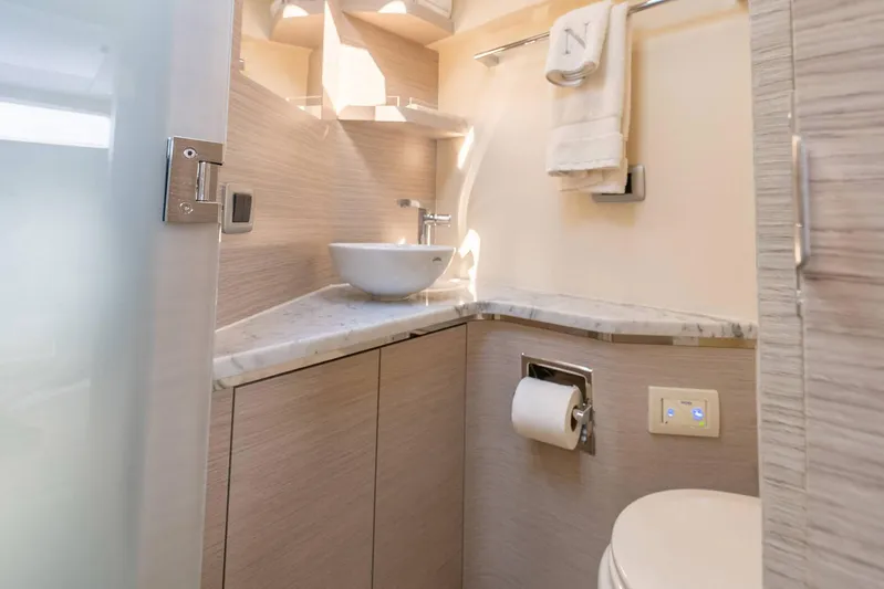 Dealership II Yacht Photos Pics Luxurious bathroom interior of 2023 Scout 530 LXF yacht with modern fixtures and marble countertop.