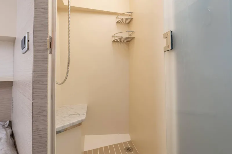 Dealership II Yacht Photos Pics Shower area in 2023 Scout 530 LXF boat, featuring modern fixtures and sleek design.