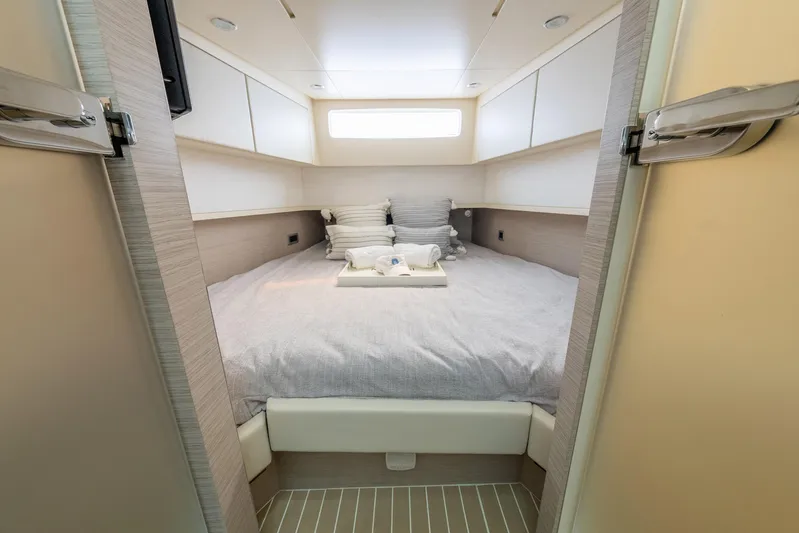 Dealership II Yacht Photos Pics Luxurious cabin interior of 2023 Scout 530 LXF yacht, featuring a cozy bed and modern design.