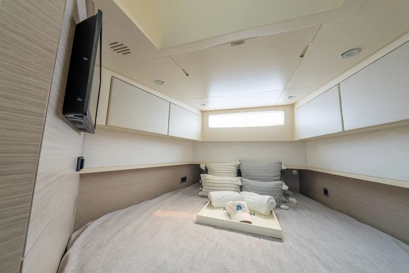 Dealership II Yacht Photos Pics Luxurious cabin interior of 2023 Scout 530 LXF yacht with cozy bedding and modern design.