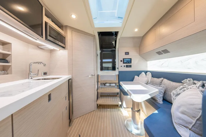 Dealership II Yacht Photos Pics Luxurious interior of 2023 Scout 530 LXF yacht with modern kitchen and cozy seating area.