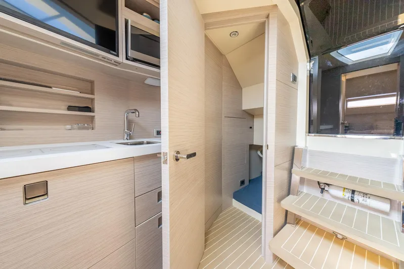 Dealership II Yacht Photos Pics 2023 Scout 530 LXF interior with modern kitchenette and sleek design.