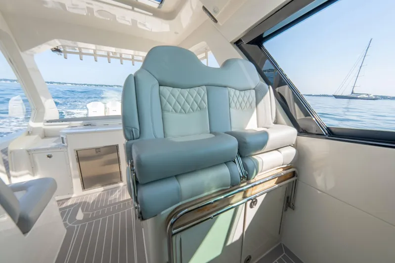 Dealership II Yacht Photos Pics 2023 Scout 530 LXF interior with luxurious seating and ocean view.