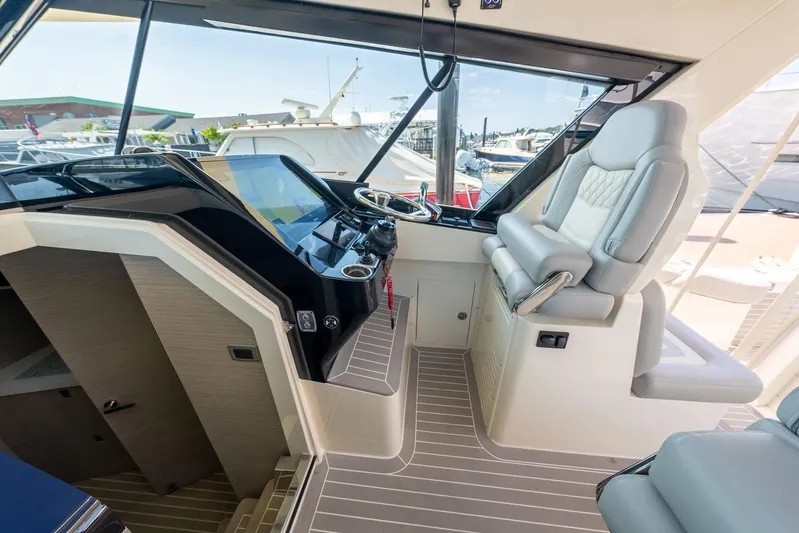 Dealership II Yacht Photos Pics Luxurious helm of 2023 Scout 530 LXF yacht with modern controls and plush seating.